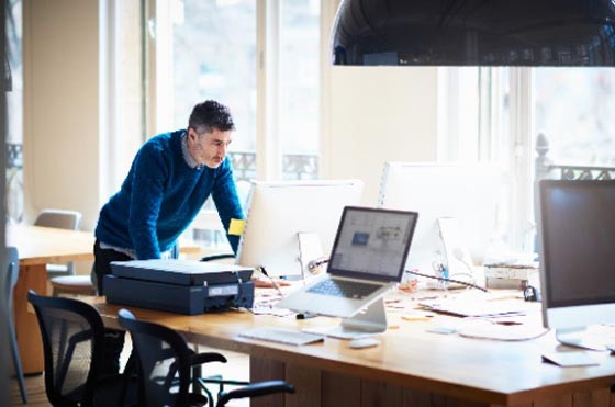 man in front of the desk