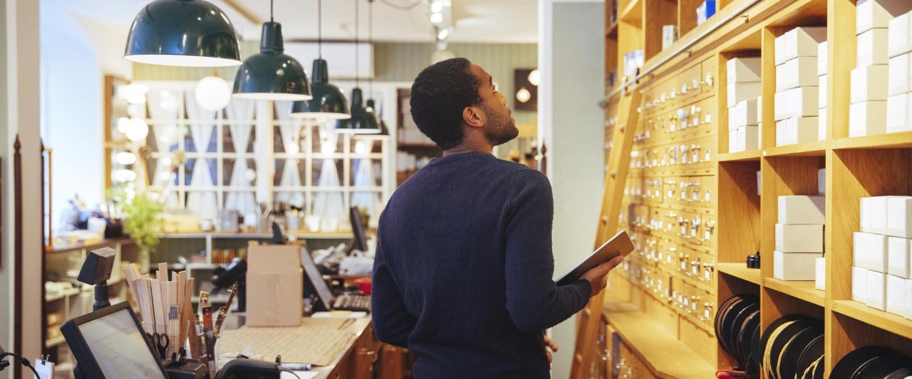 man collecting ordered items  in the shop