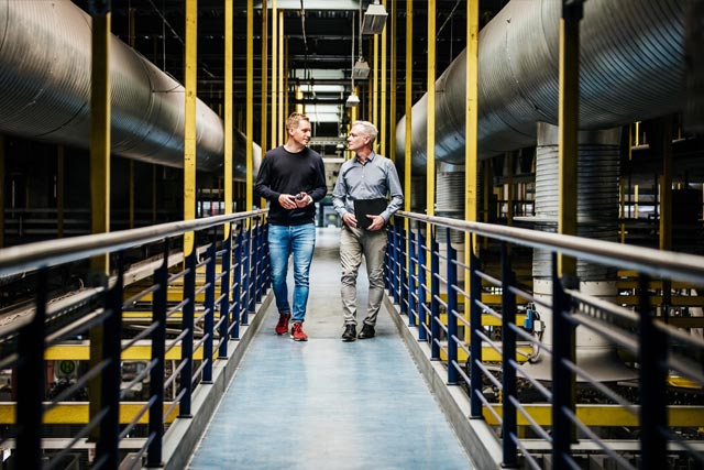 two man in the factory