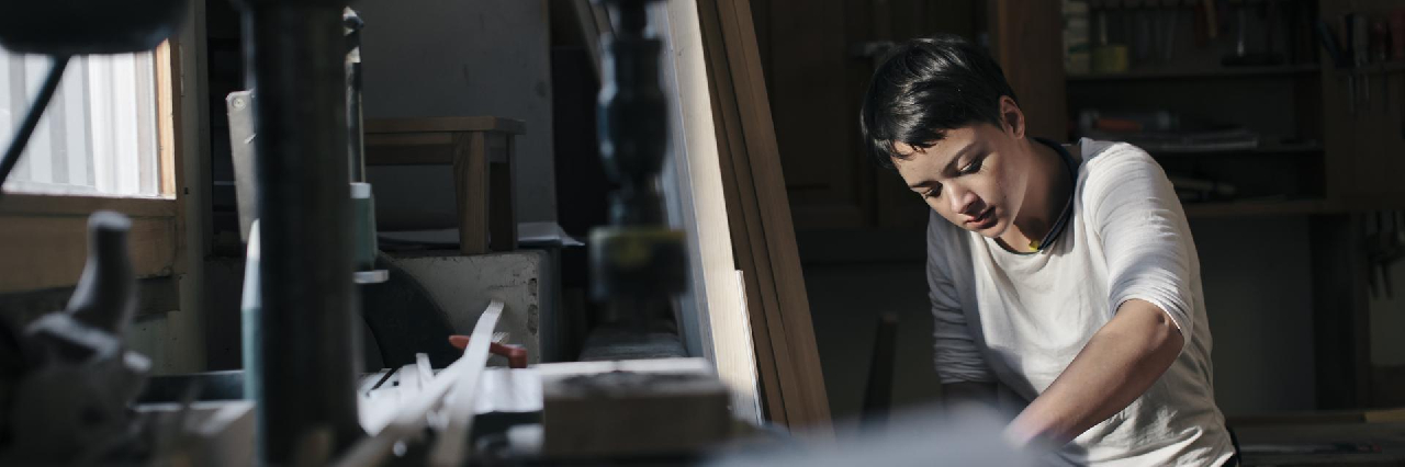 A female doing woodwork