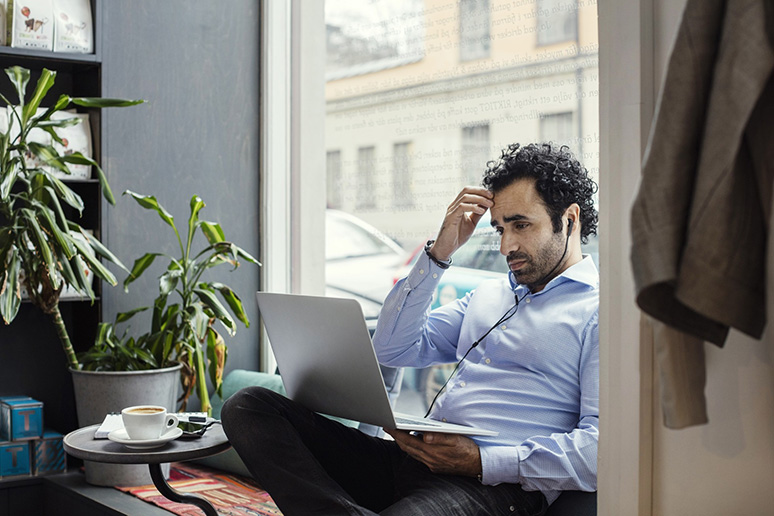 A man is using a computer