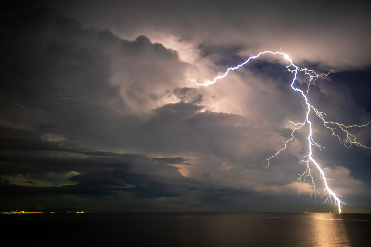 lightning bolt going to down to ocean