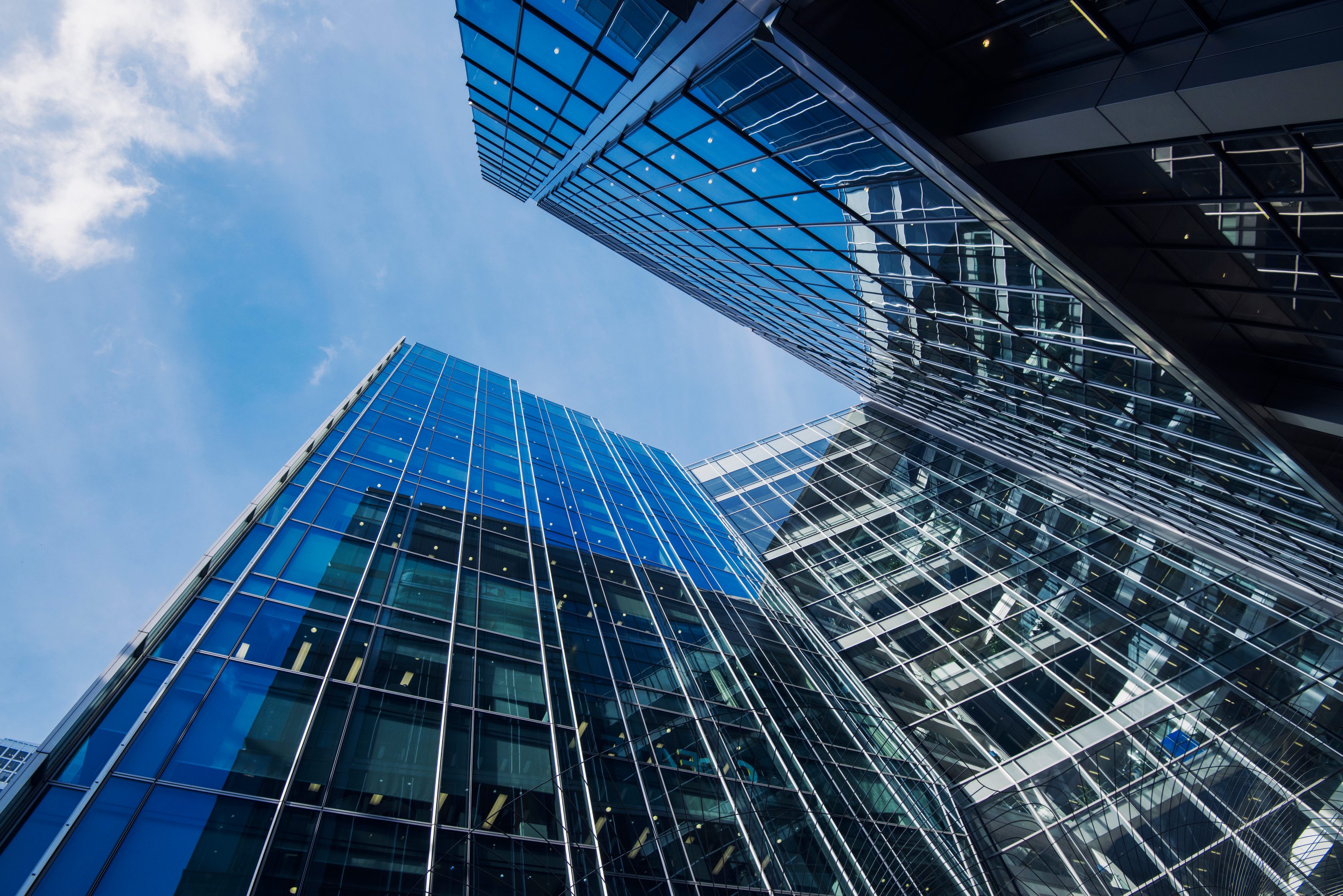 ground level view of skyscapers in city