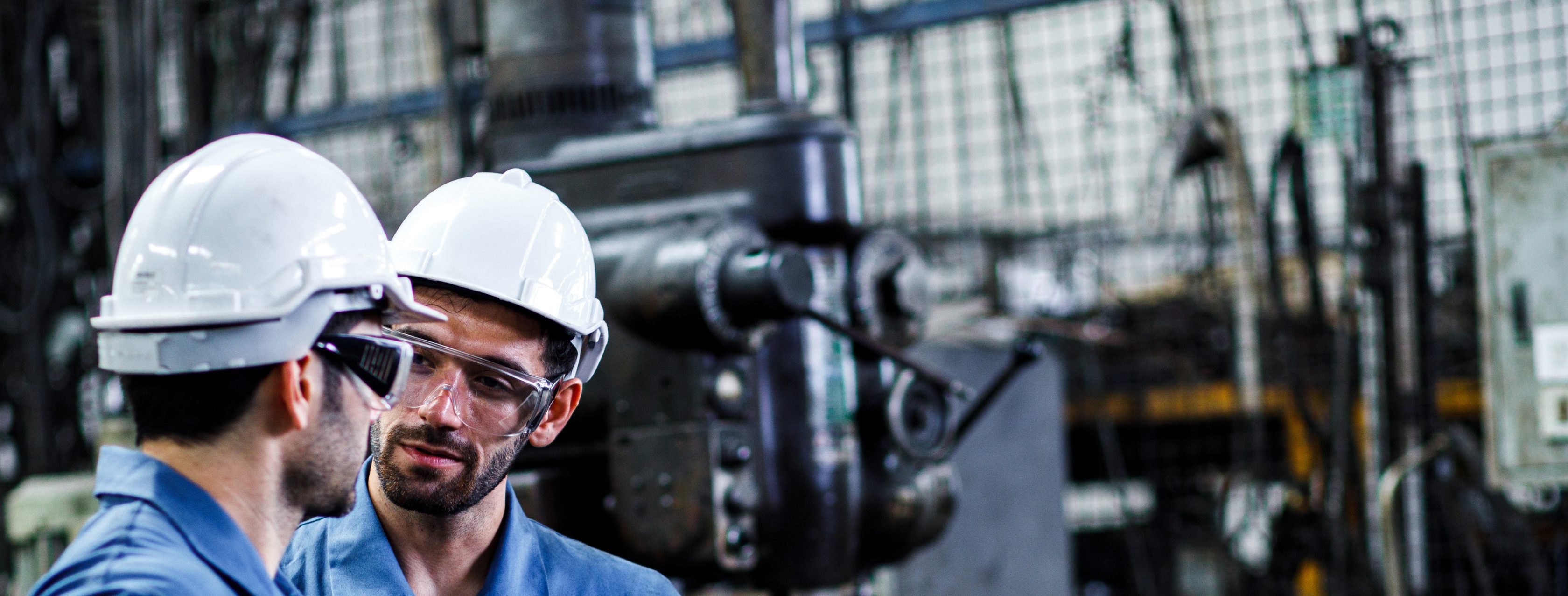 two men talking in IT room setting