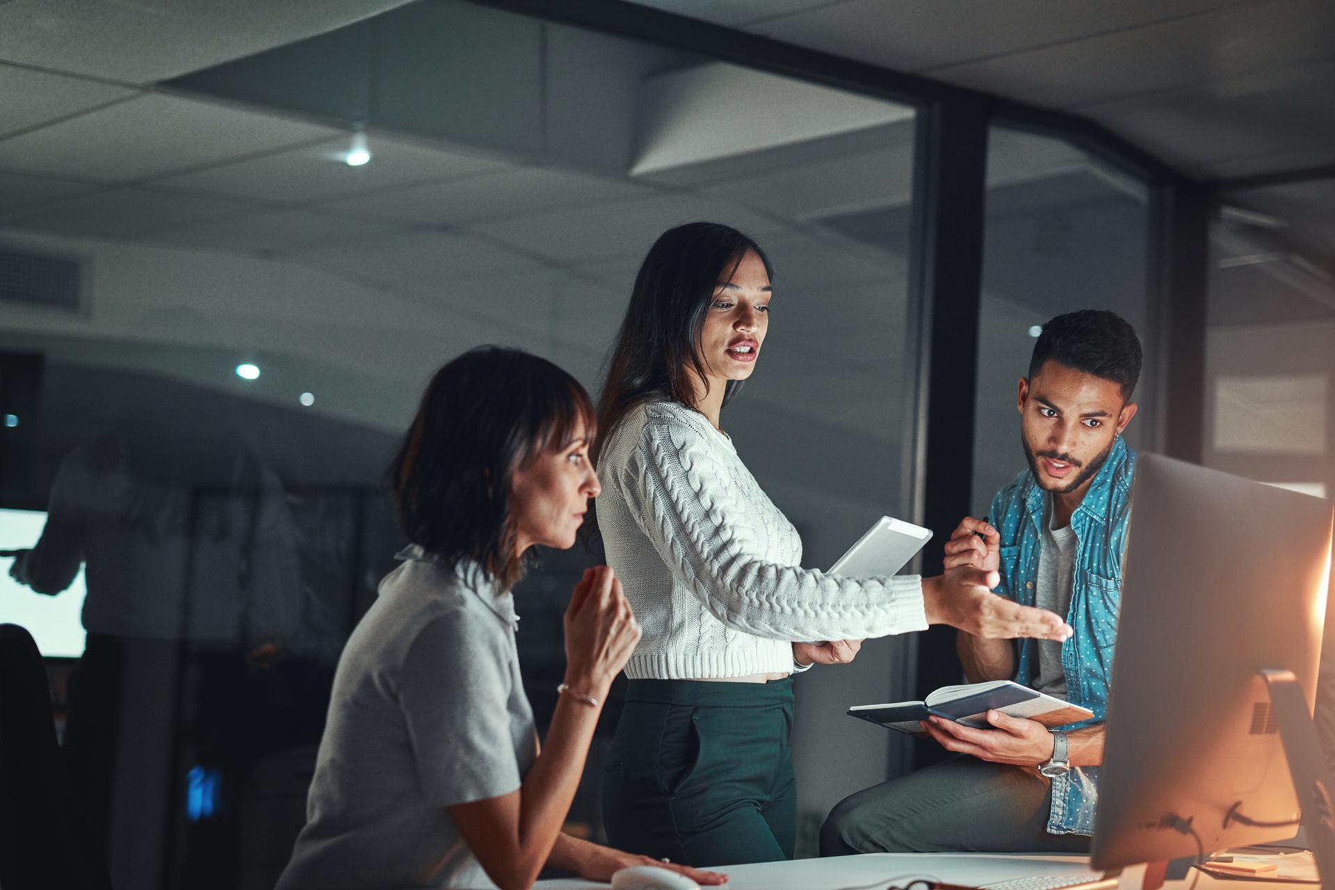 three co-workers in office setting