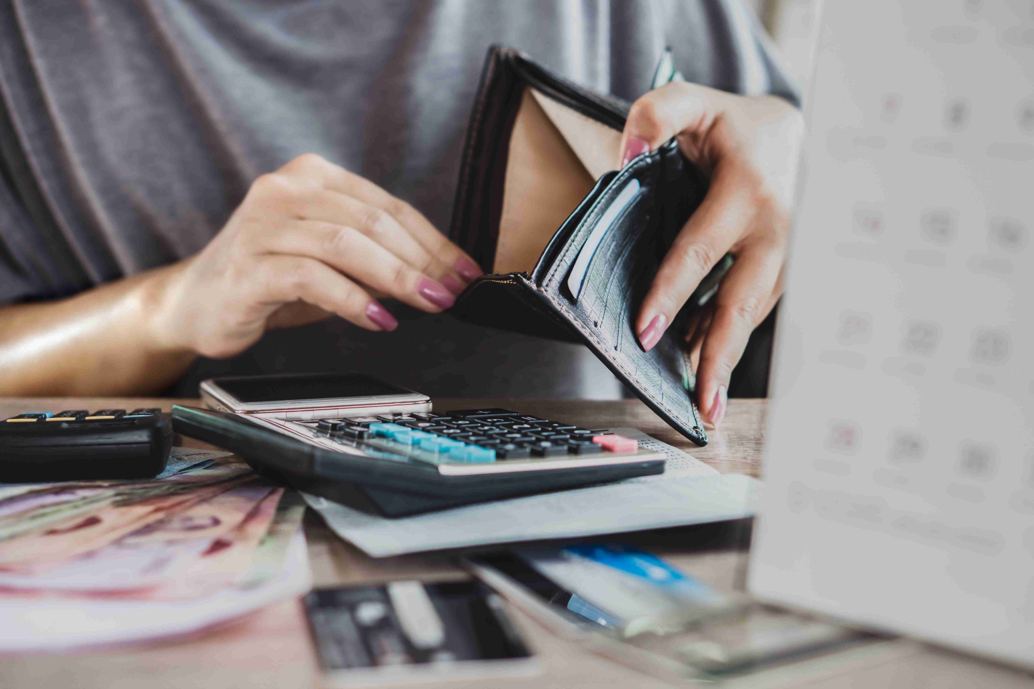 woman look into her wallet representing  Credit risk management process