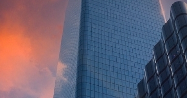 skyscrapers in front of a sunset sky